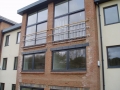 Stainless steel Juliet Balconies with timber handrail, Admirals Quarter